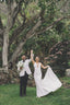 Founder of Always Tomiko on her wedding day being spun around by her husband