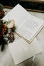 testimonial photo of always tomiko his and her wedding vow books with his book open with handwritten vows from customer